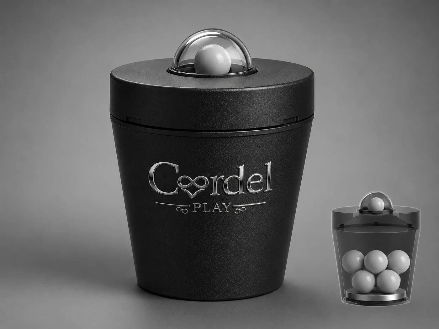Cordel Play Consent Cup: matte black cup with engraved silver Cordel Play wordmark and a clear dome lid capturing a consent sphere